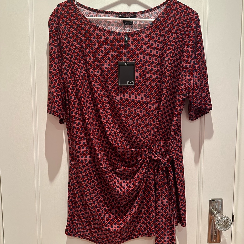 NWT. Polyester/spandex pullover blouse. Great for the office.